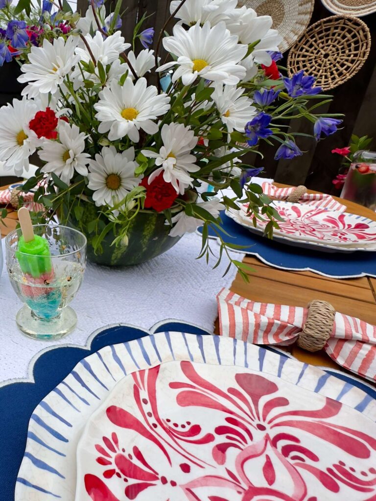Summer centerpiece featuring a watermelon vase.