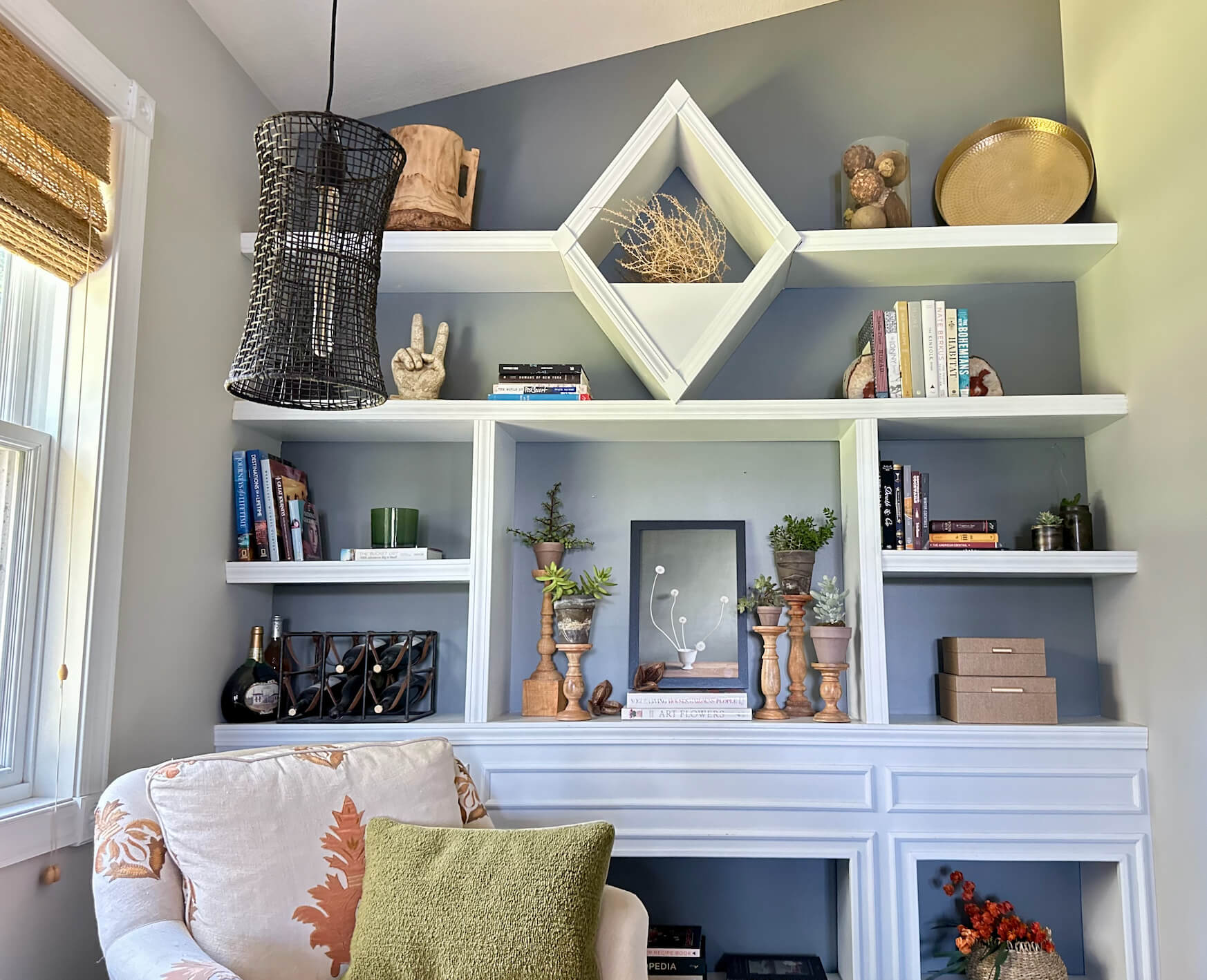 Bookshelves styled for Fall with Plants and Art.