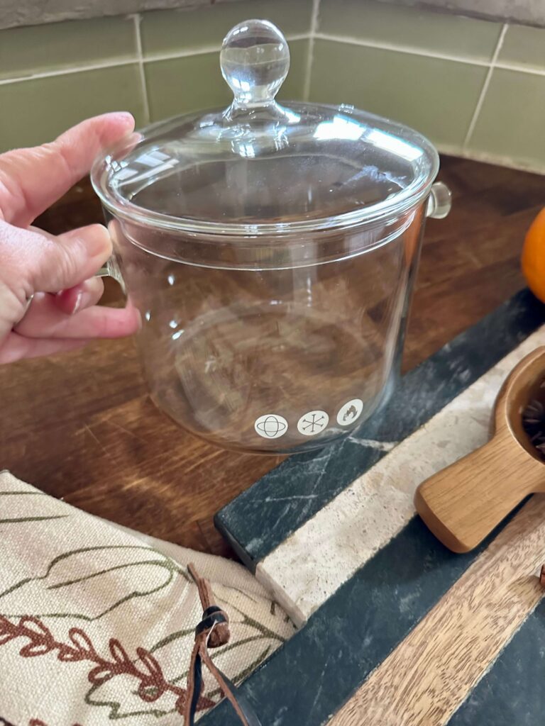 A Glass pot for a stovetop potpourri