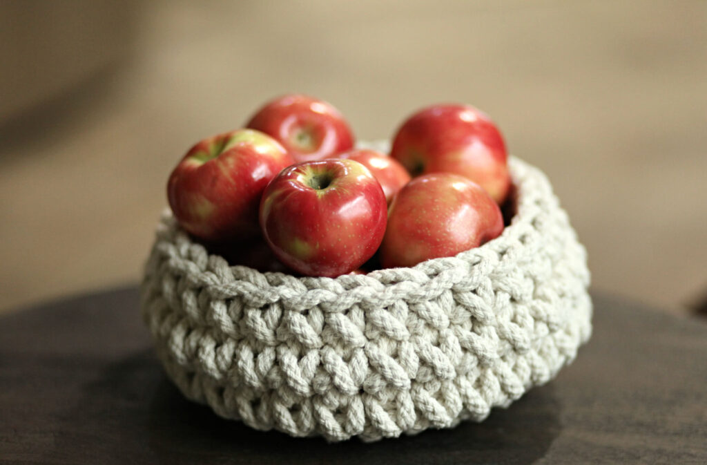 Woven basket with Crisp Michigan apple as Fall Decor.
