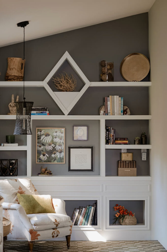 Bookcase filled with online home decor pieces.