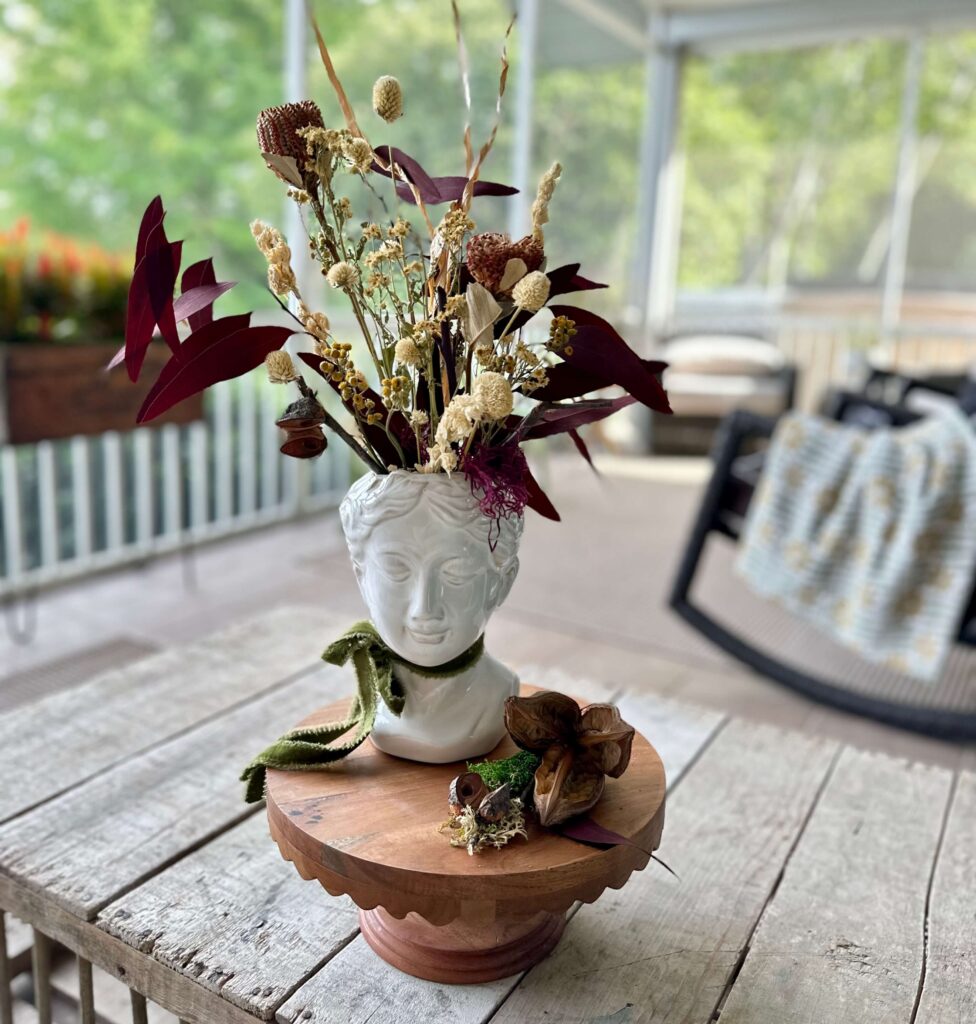 Lady Head Vase filled with dried florals as Fall Decor.