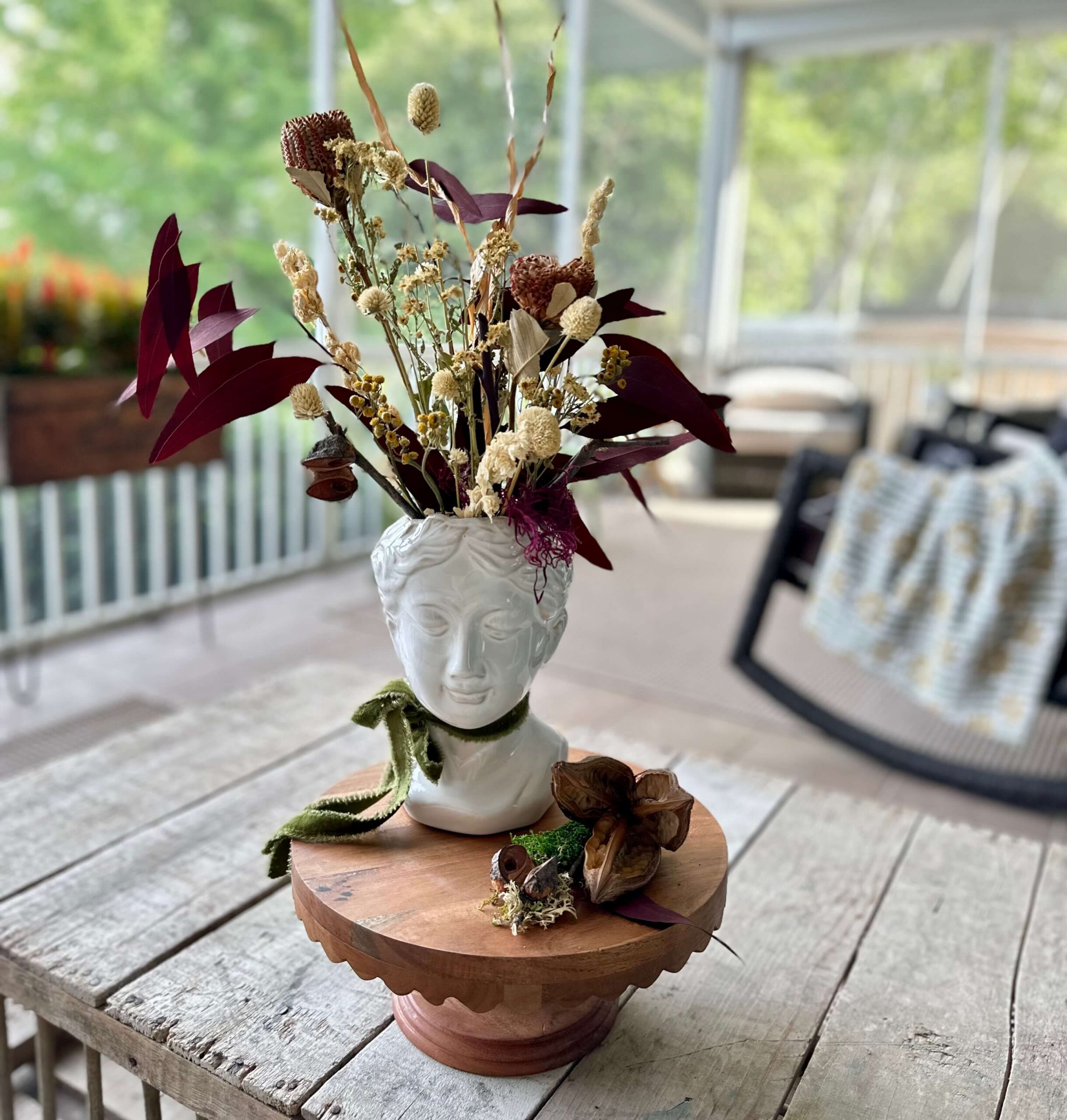 White LAdy Head Vases filled with dried flowers