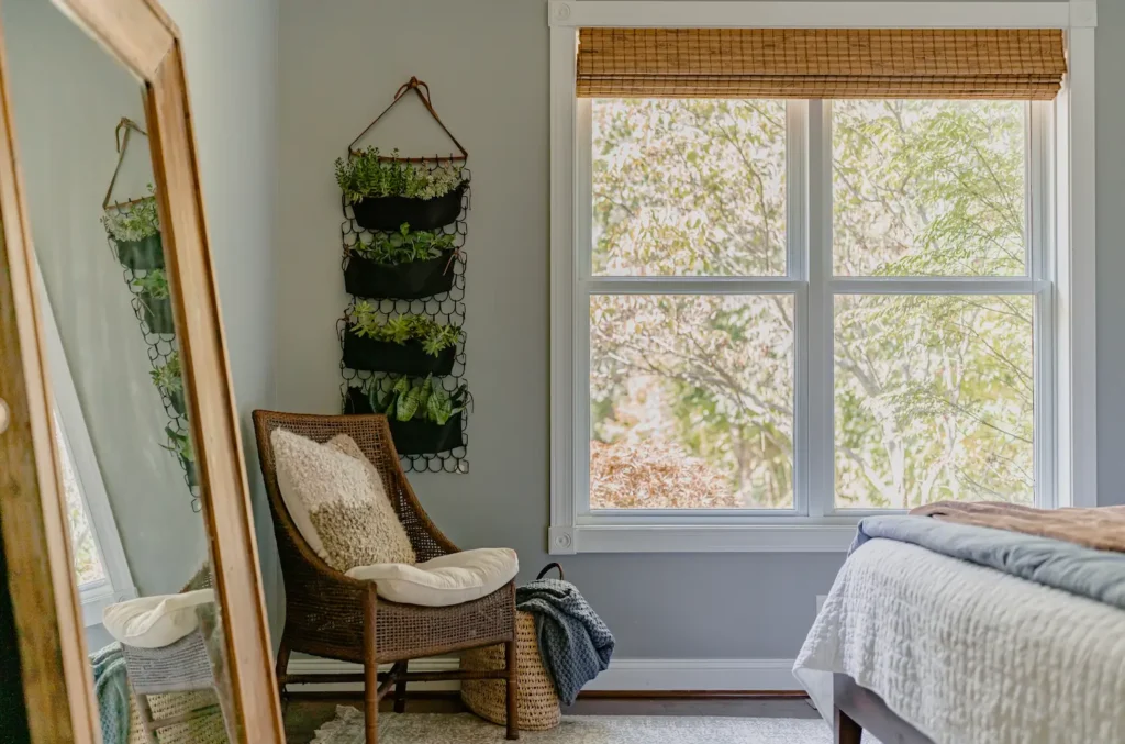 decor elements, from plush throw blankets, blue and brown bedding,  neutral pillows, and other fall bedroom elements.