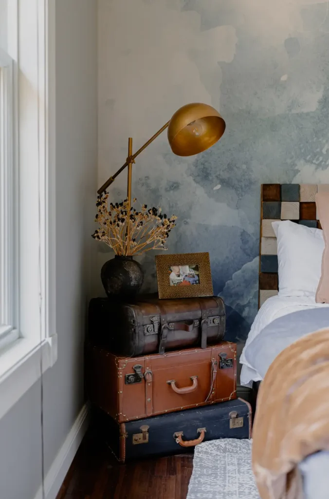 Vintage Suitcases as a night stand with Fall Decor in a bedroom.