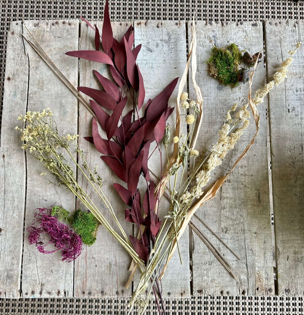 Dried flower stems in warm colors.