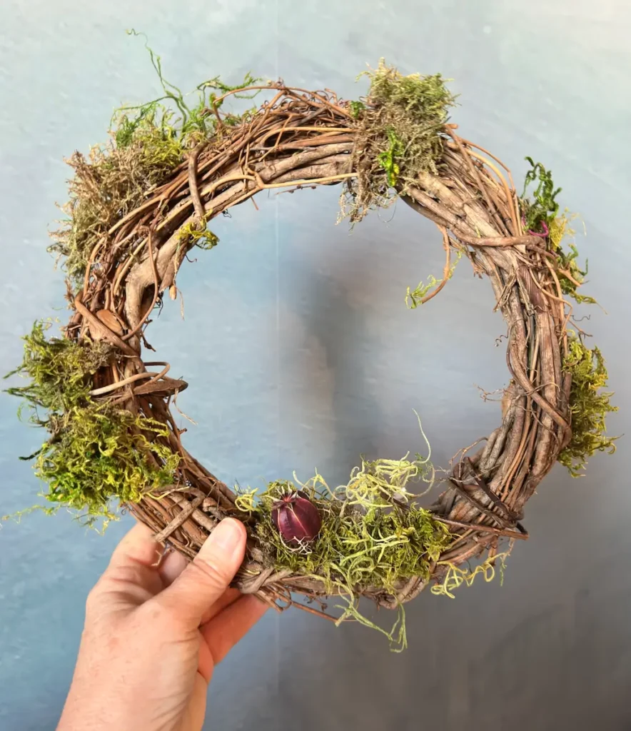 Grpaevine wreath with moss.