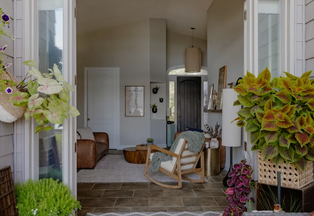 Open Doors from a cavered porch looking into a warm living space.