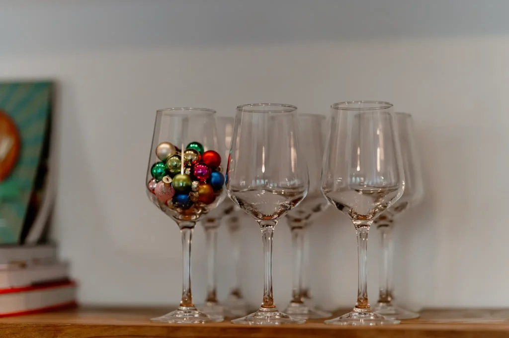 Wine glass with mini glass ornaments.
