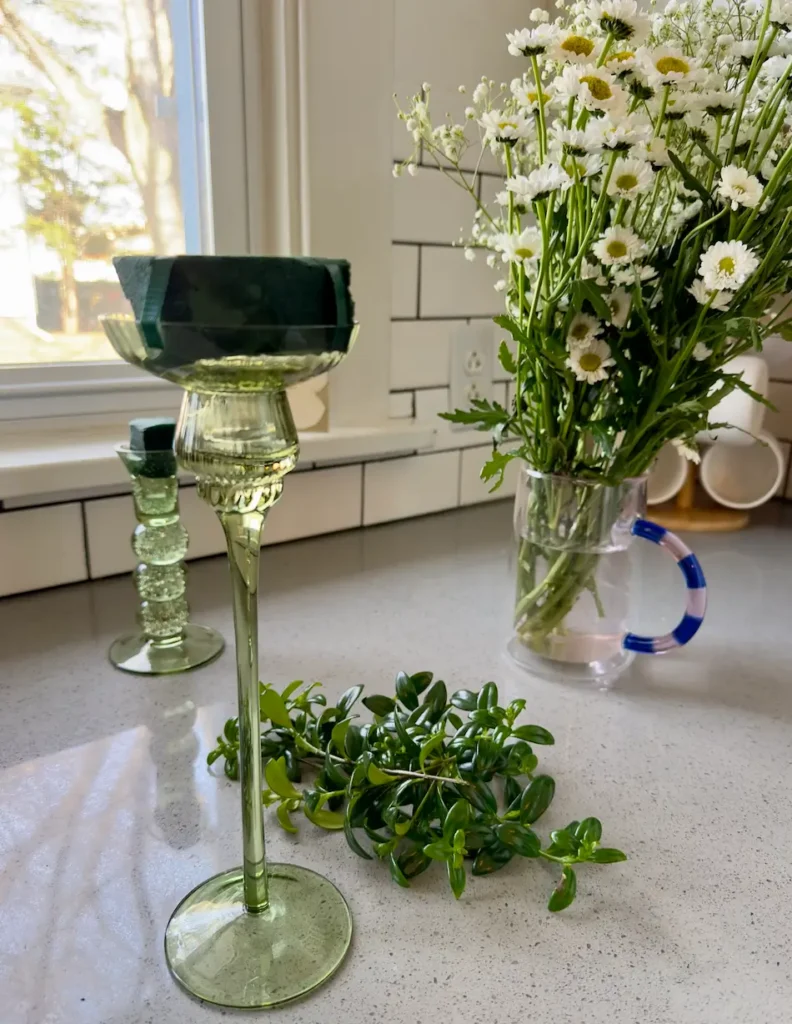 Green Candlesticks used for mini table arrangements.