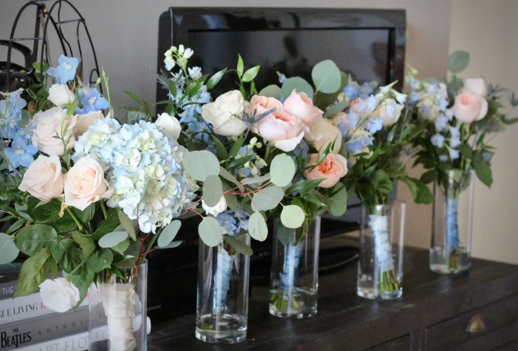 Something blue bouguets for a summer wedding with hydrangea, delphinium and garden roses.