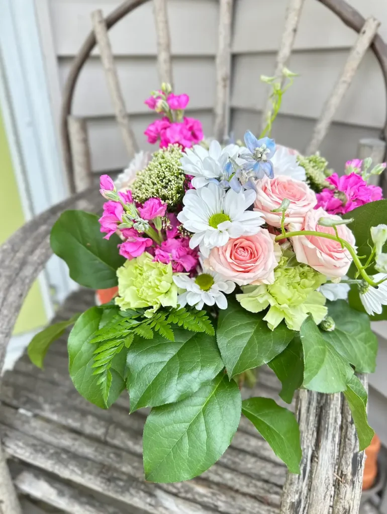 1-800-Flowers Delphinium Garden arrangement for Mother's Day. Featuring delphiniums, roses, daisies and more. 