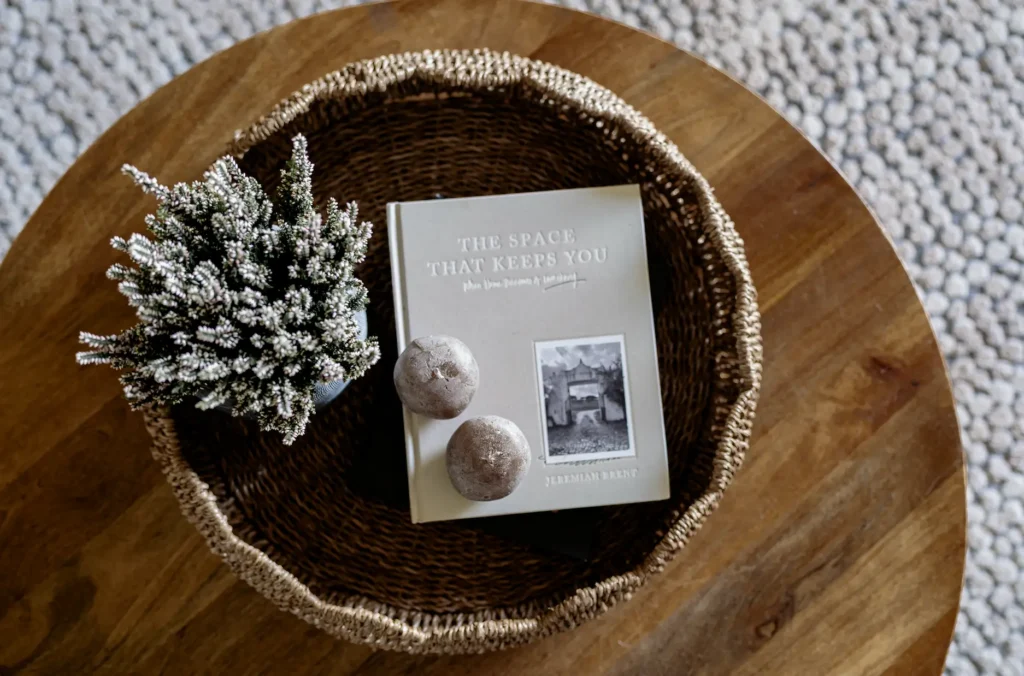 Vintage tray holding candles, plant and Design Coffee Table Books.