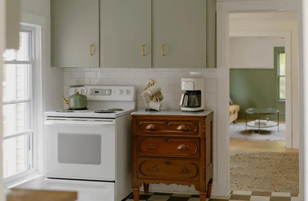 If you’re dreaming of green cabinets and want a shade that feels grounded, timeless, and full of character, SW 9132 Acacia Haze needs a spot on your sample board. It’s the color that truly made our 125-year-old kitchen feel like home.